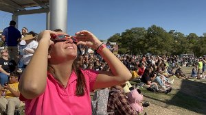 Crowd watching a solar eclipse