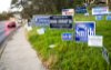 Campaign signs on side of highway