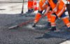 Workers repairing road