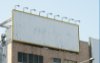 Blank billboard sign on top of a building