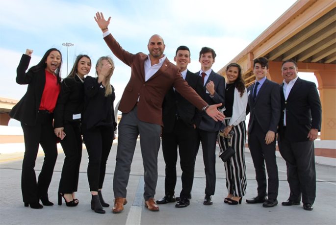 Students from United High School in Webb County with County Judge Tano Tijerina as he attends a ribbon-cutting for a highway